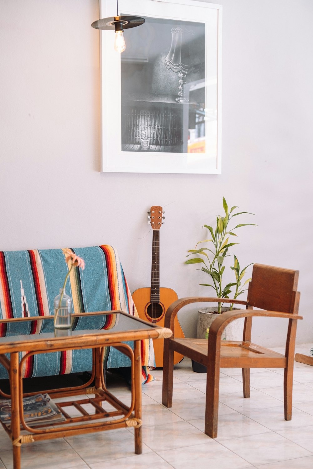 a living room filled with furniture and a guitar