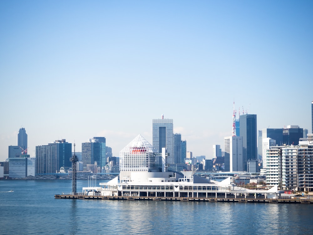 a large body of water with a city in the background