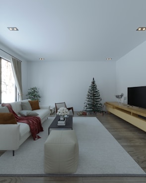 a living room filled with furniture and a flat screen tv