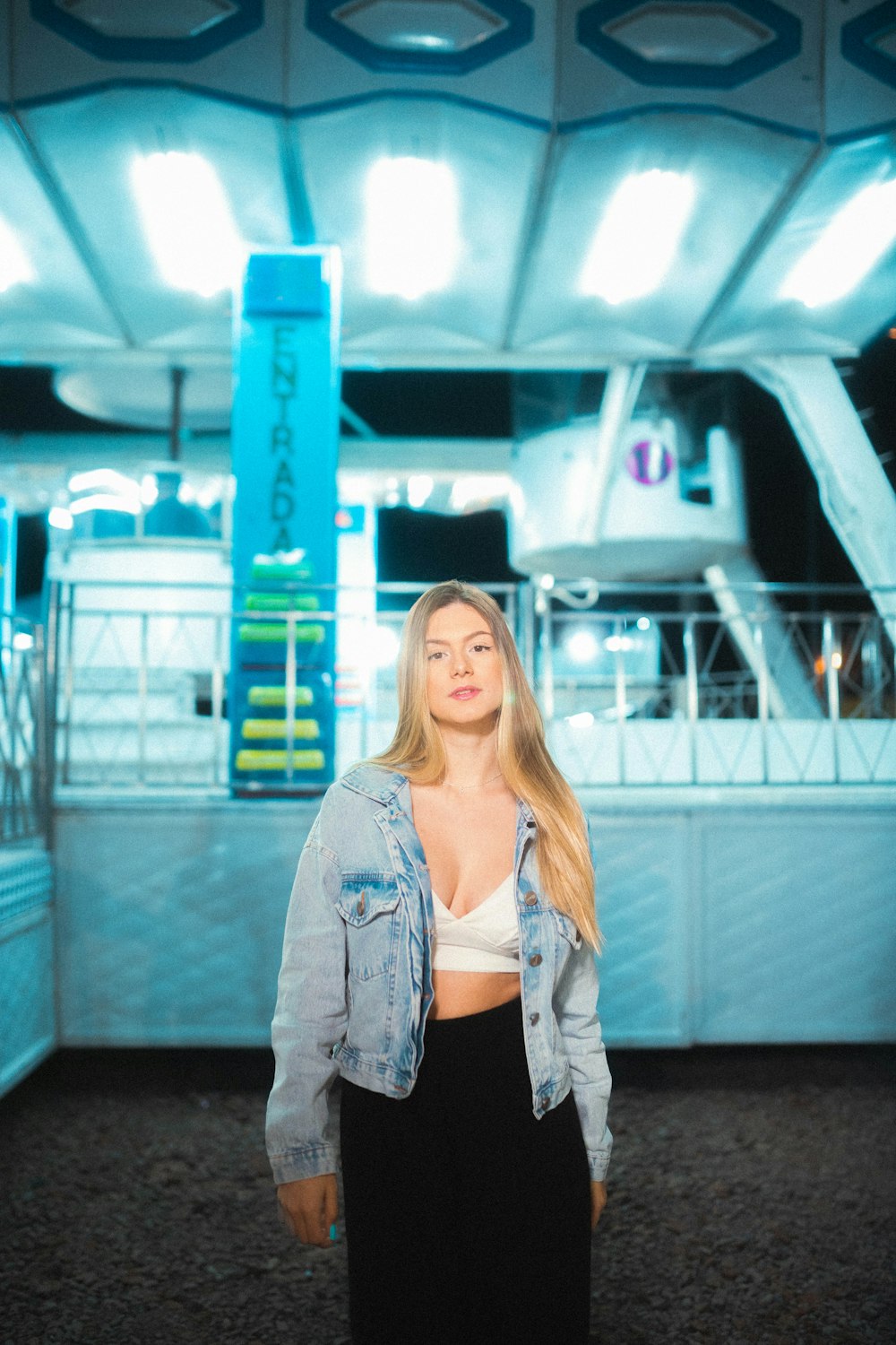 a woman standing in front of a boat