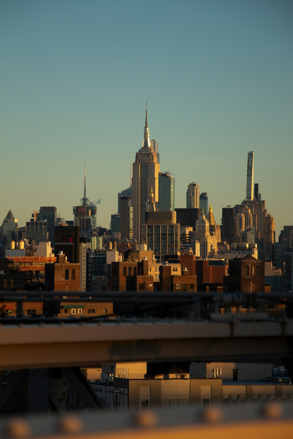 a view of a city skyline from a bridge