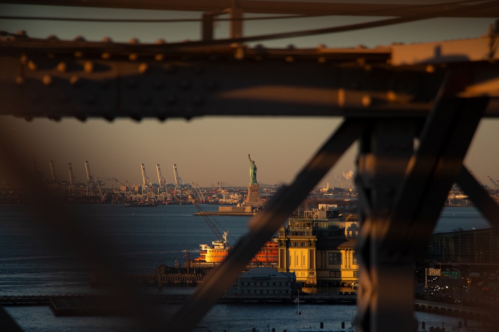 a view of the statue of liberty from the top of a building