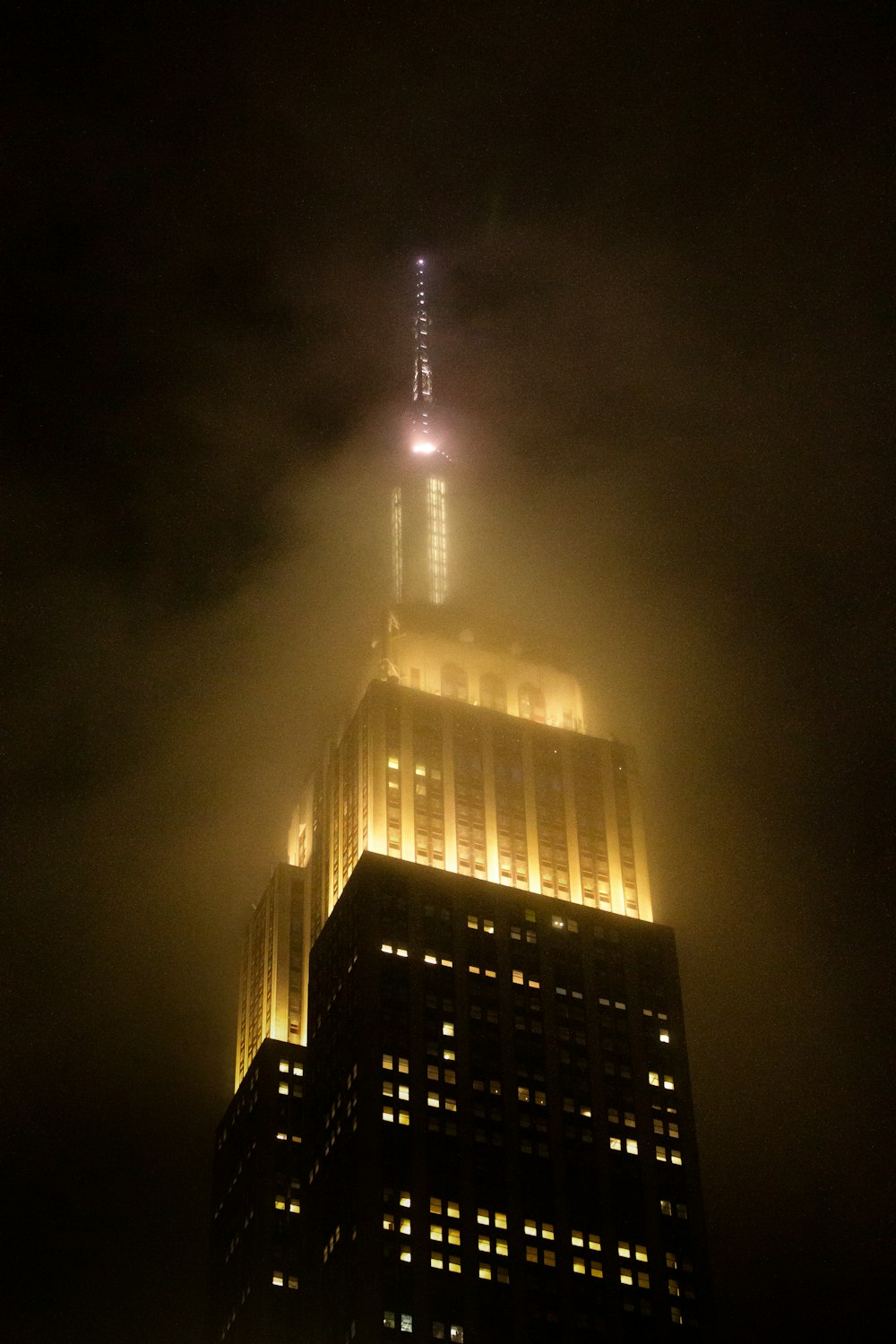 a very tall building lit up at night