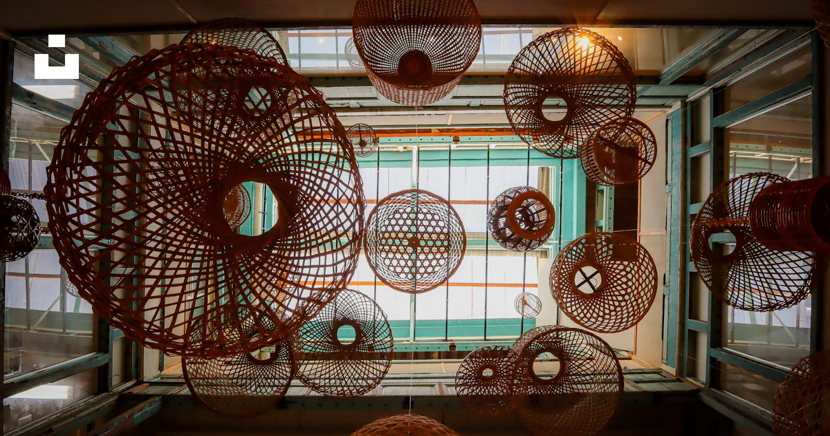 A room with a bunch of round objects hanging from the ceiling photo ...