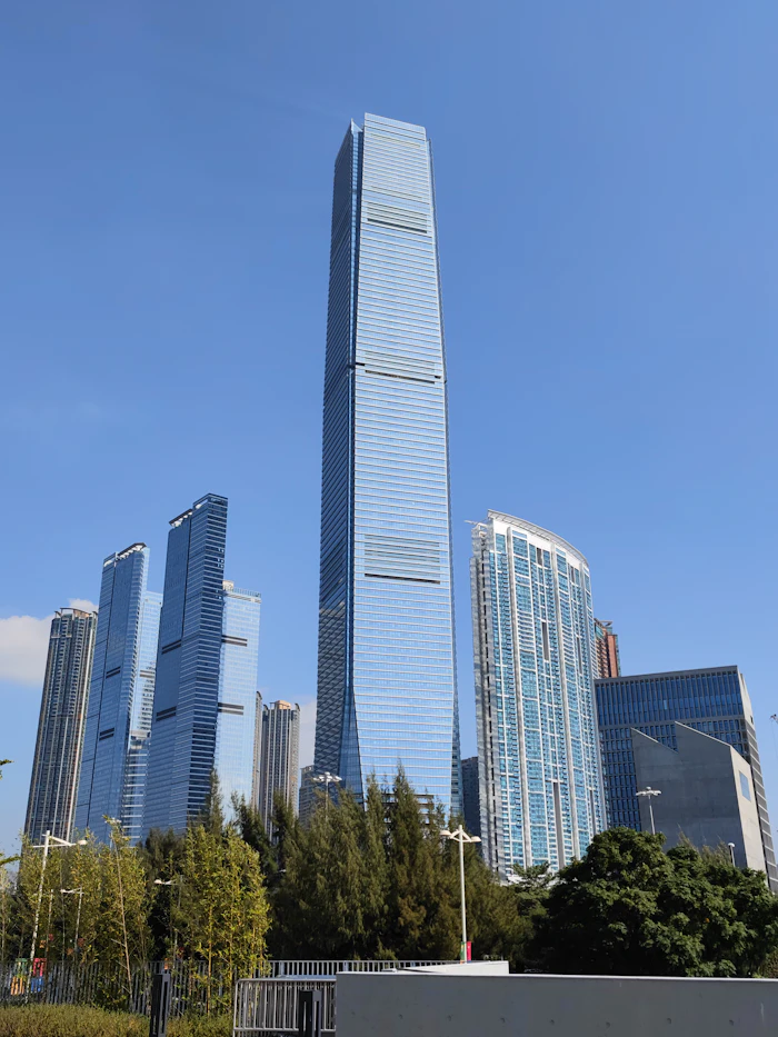 Tall office tower among city buildings