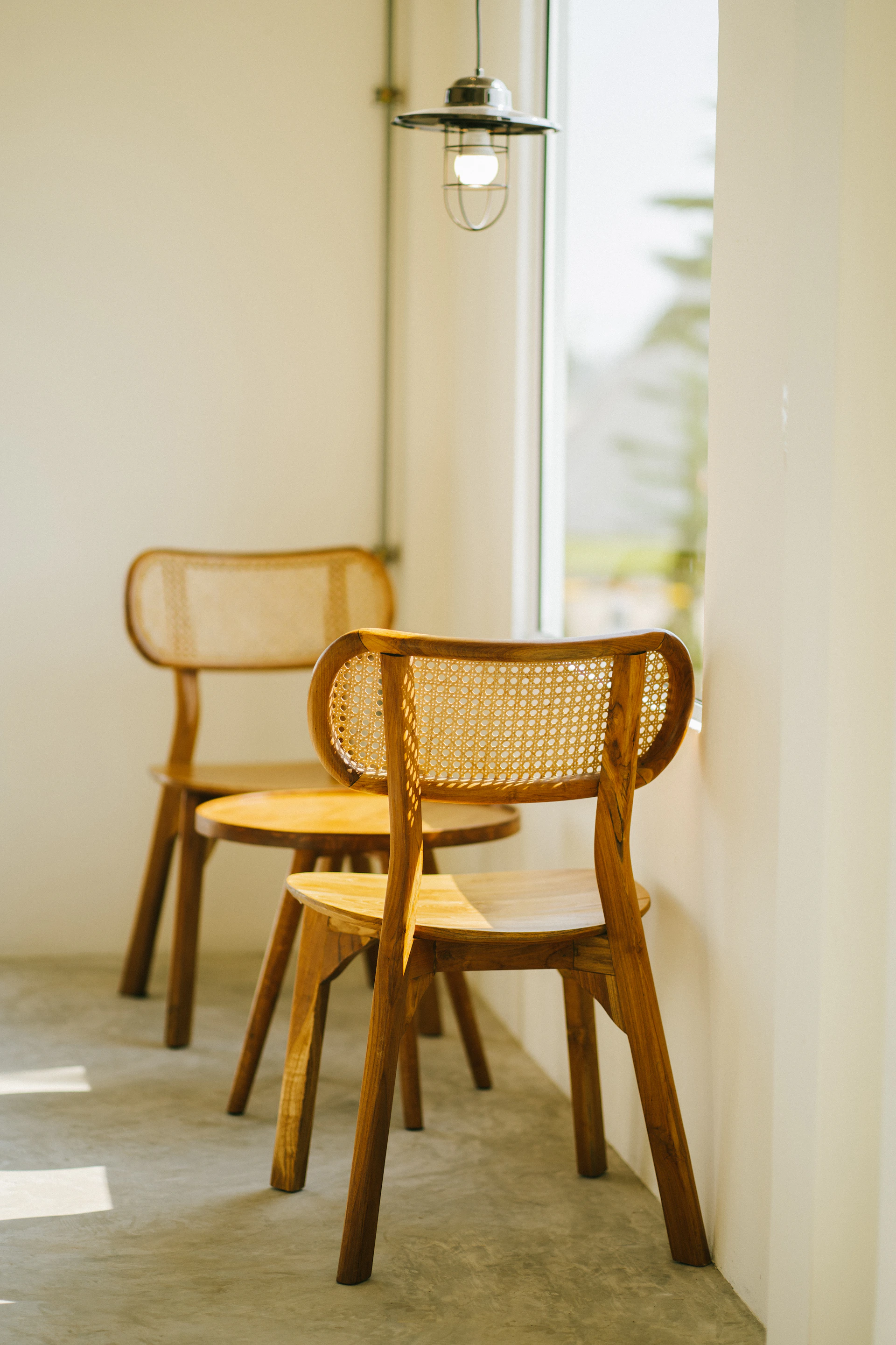 a couple of wooden chairs sitting next to each other