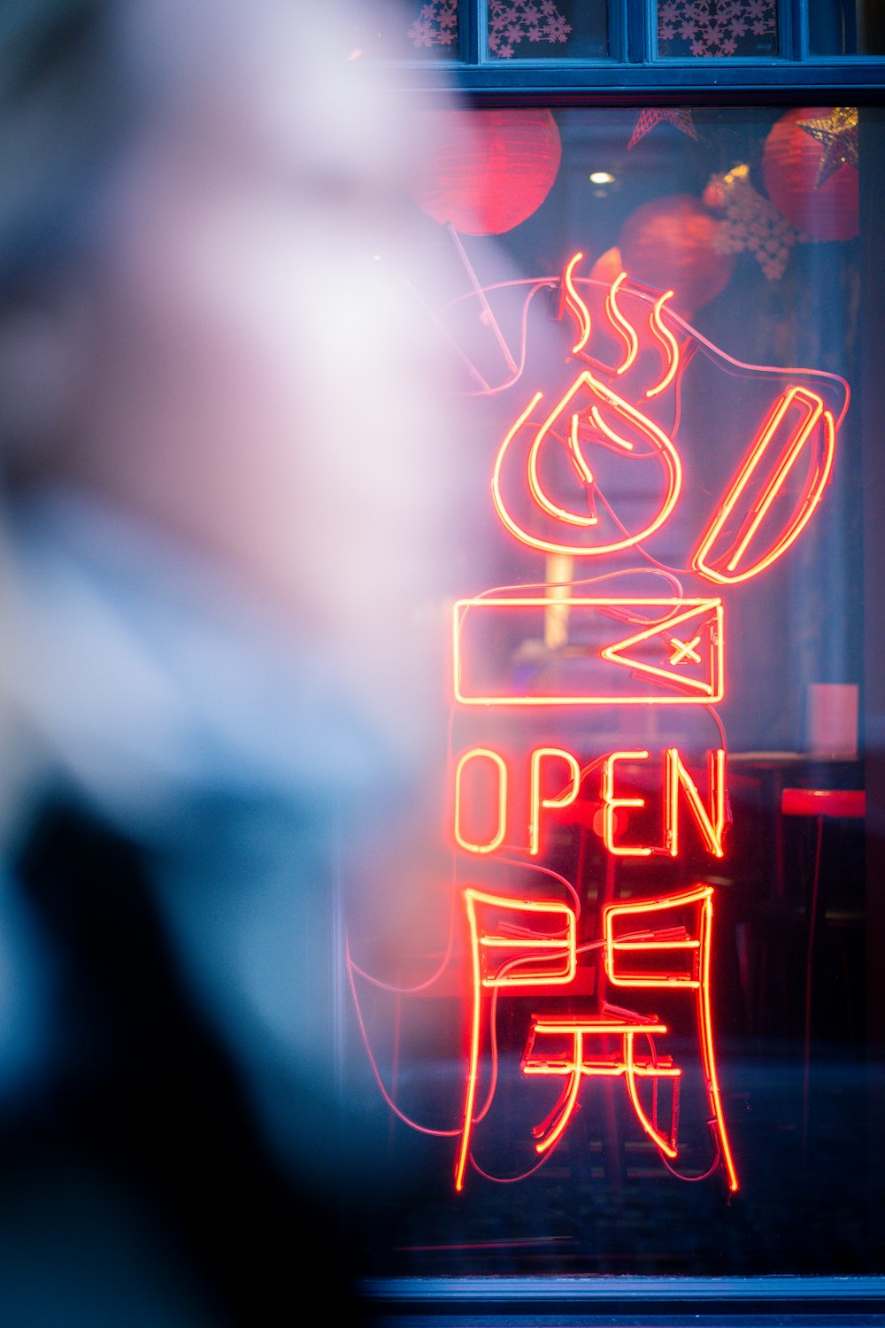 a neon sign that says open for business