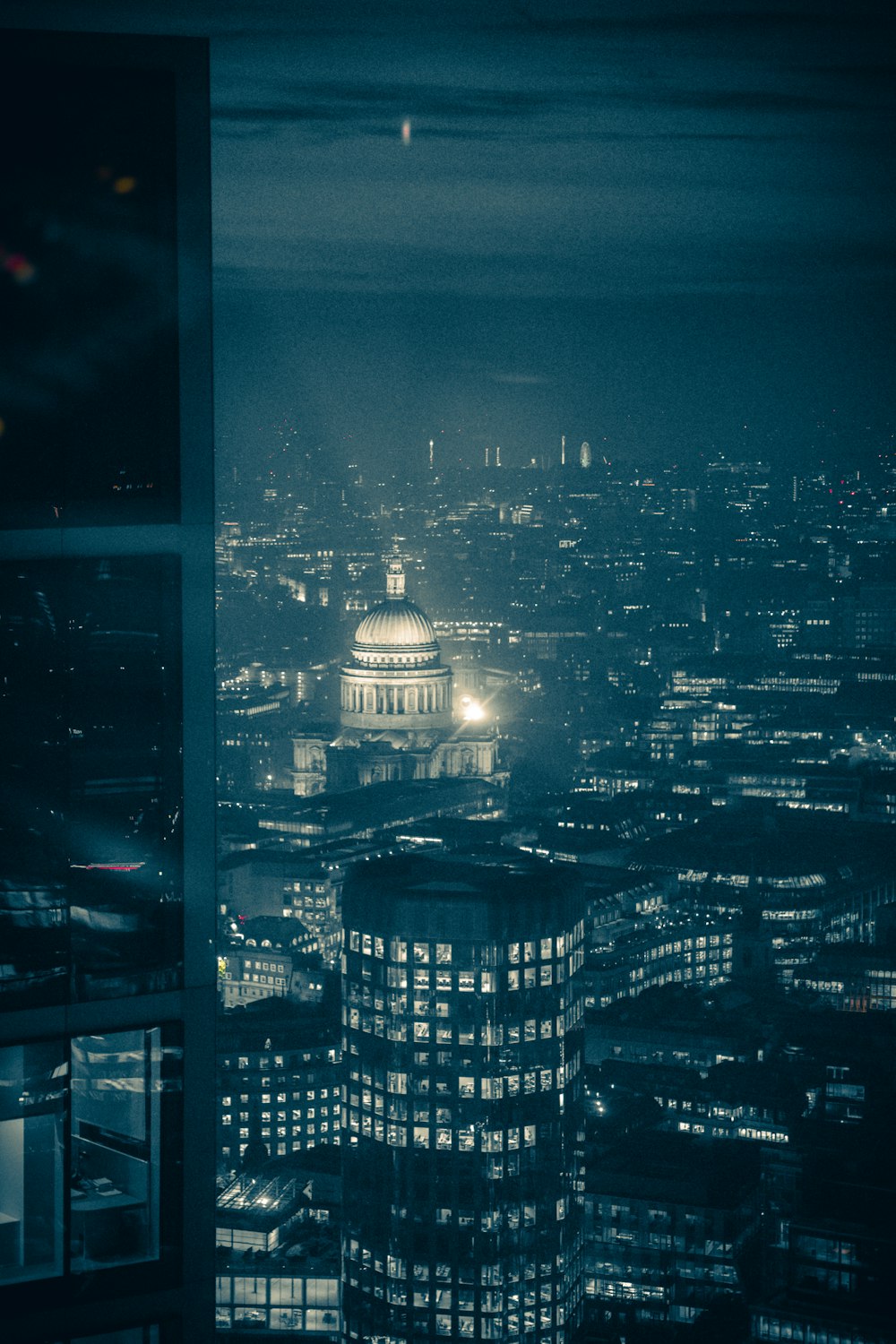 a view of a city at night from a window