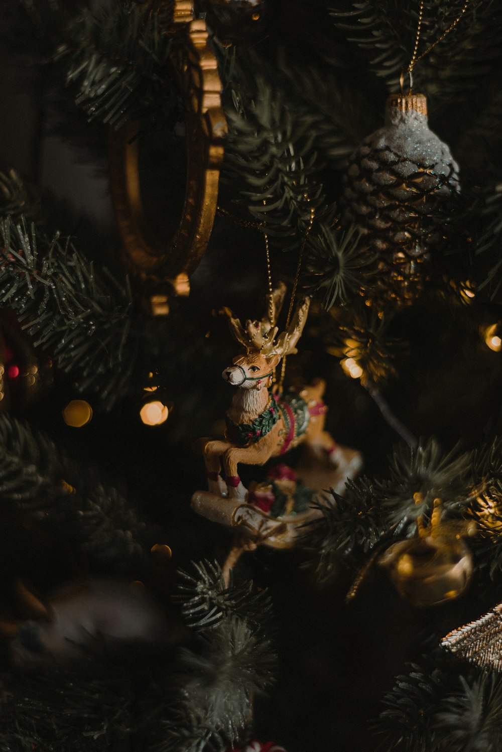 a close up of a christmas tree with ornaments