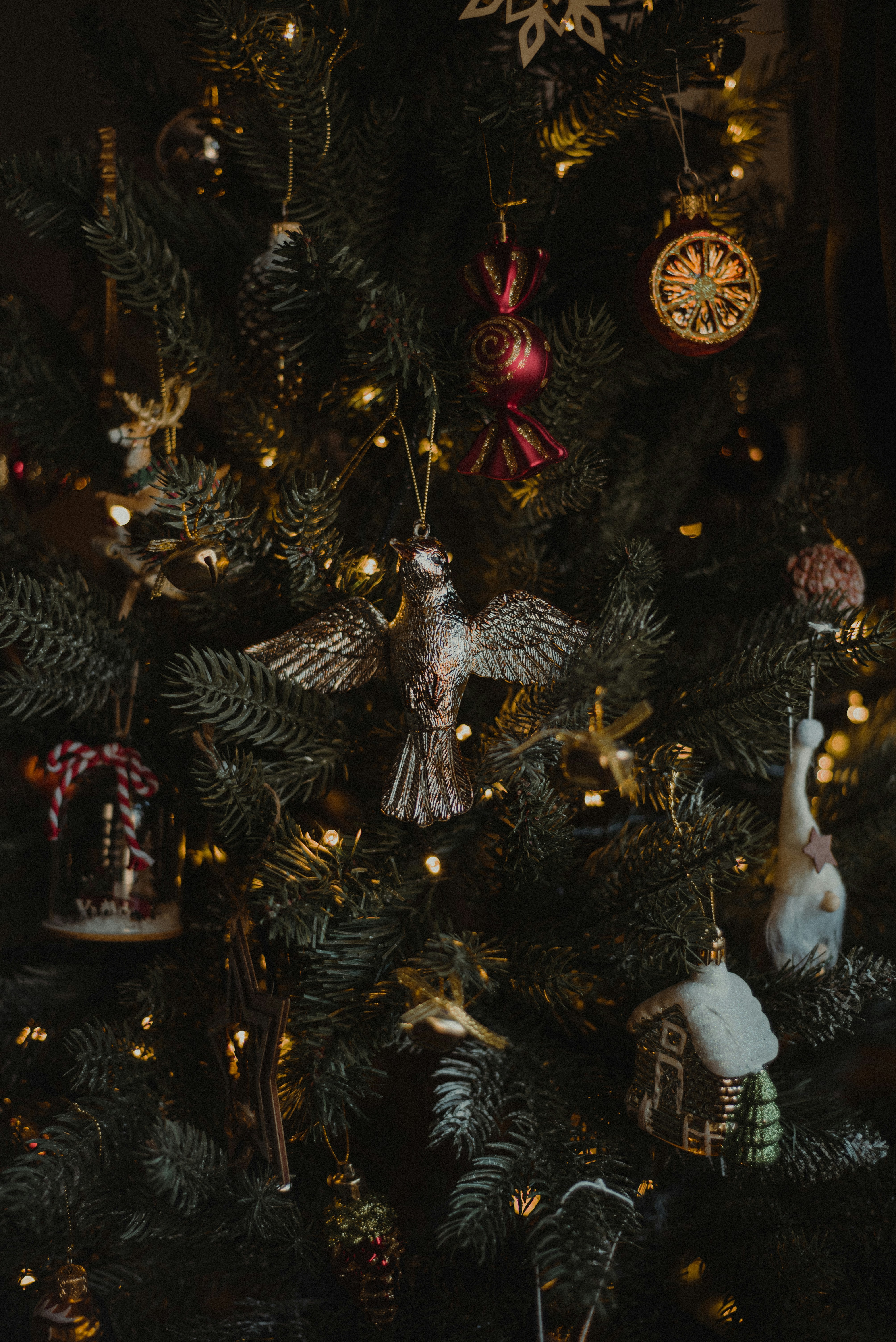 a close up of a christmas tree with ornaments