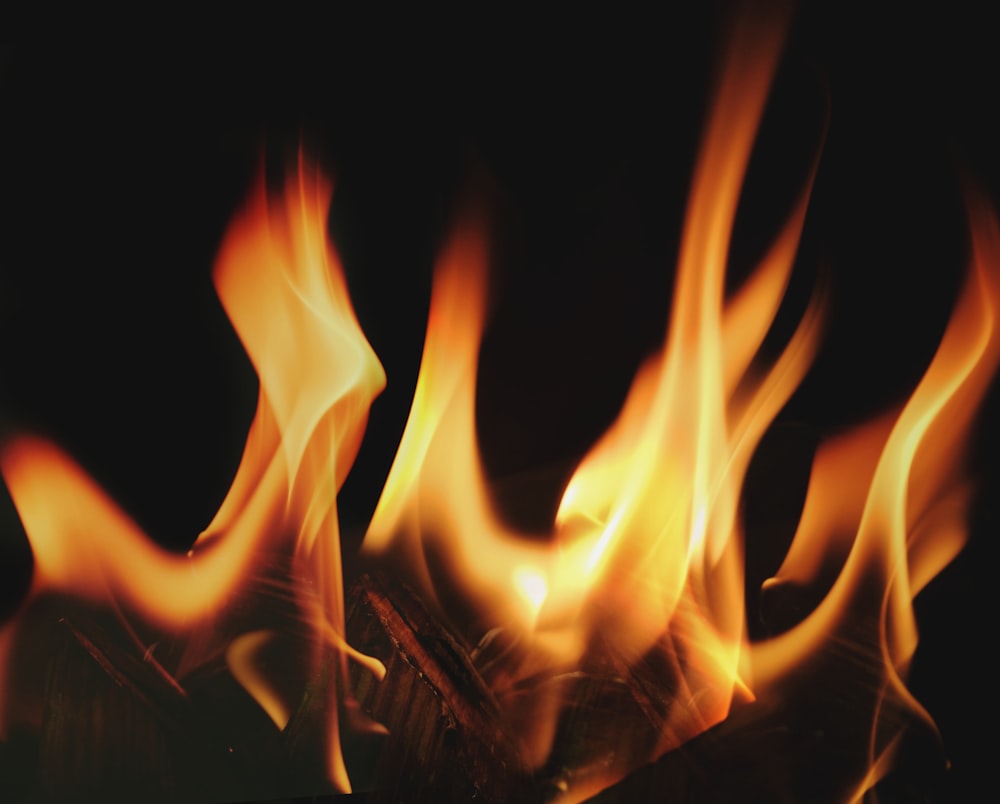 a close up of fire flames on a black background