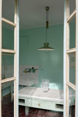 Sparkling clean kitchen with mint green accents and polished countertops