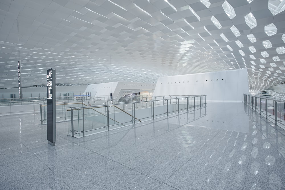 a large white building with a metal railing in front of it