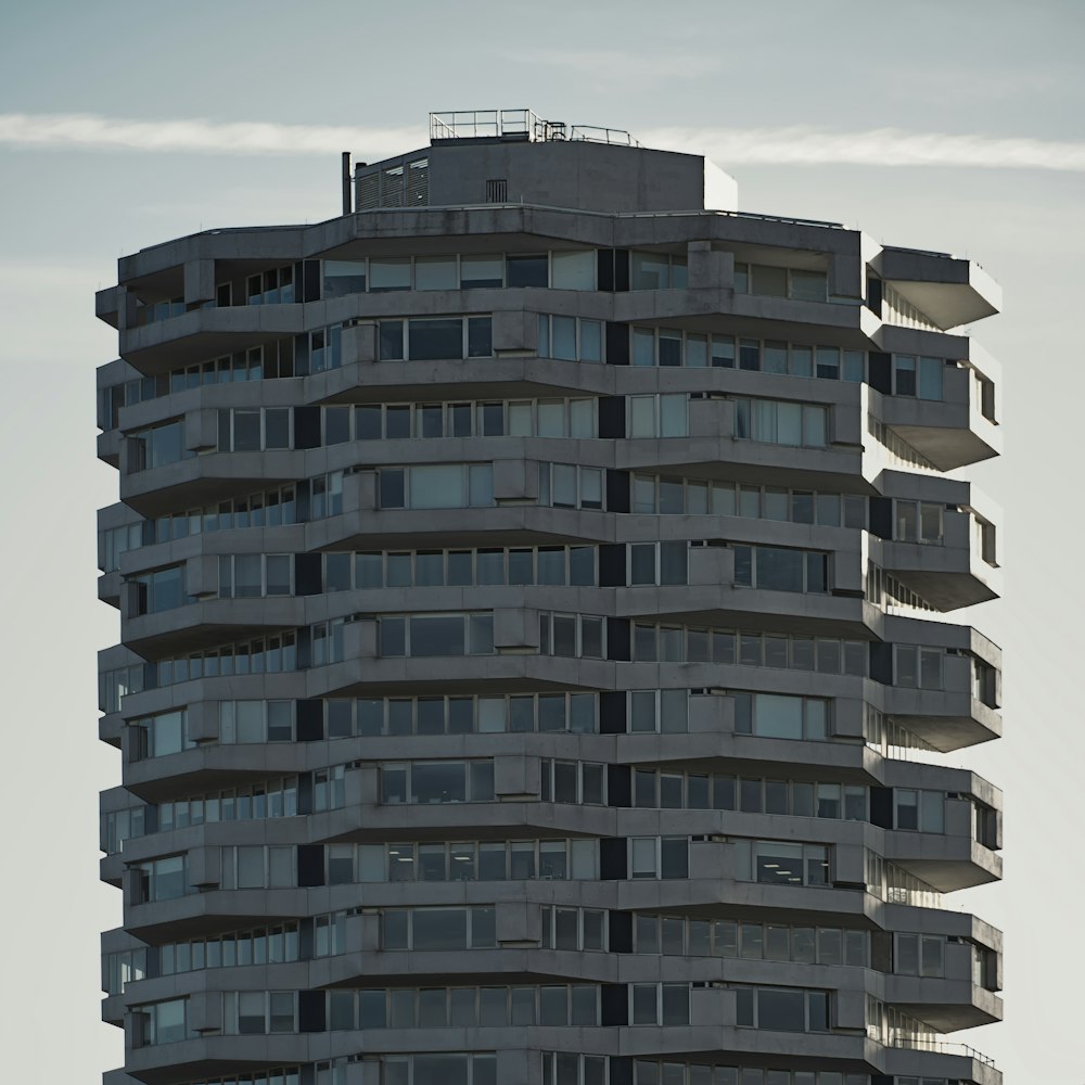 a tall building with balconies on top of it