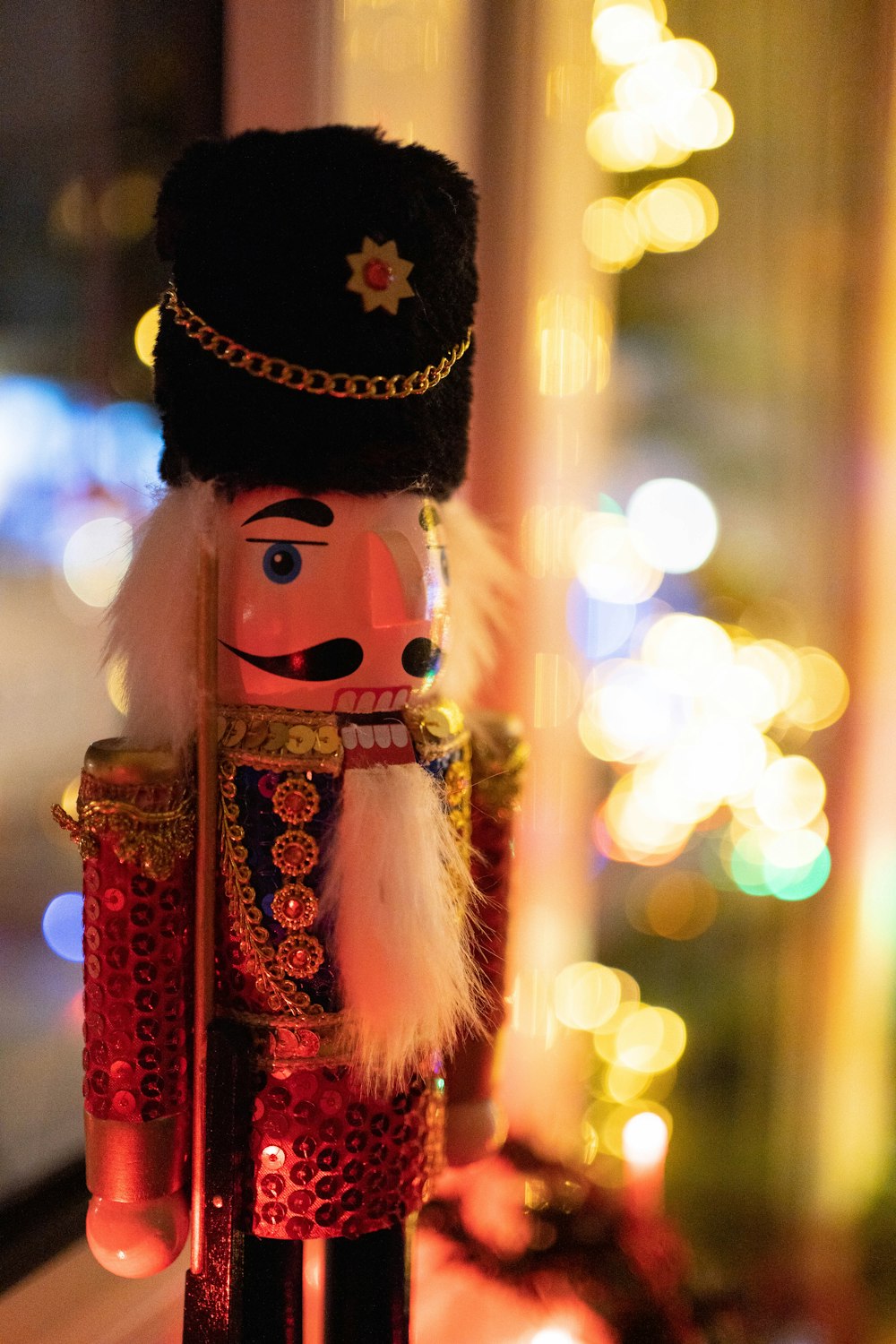 a nutcracker is standing in front of a window