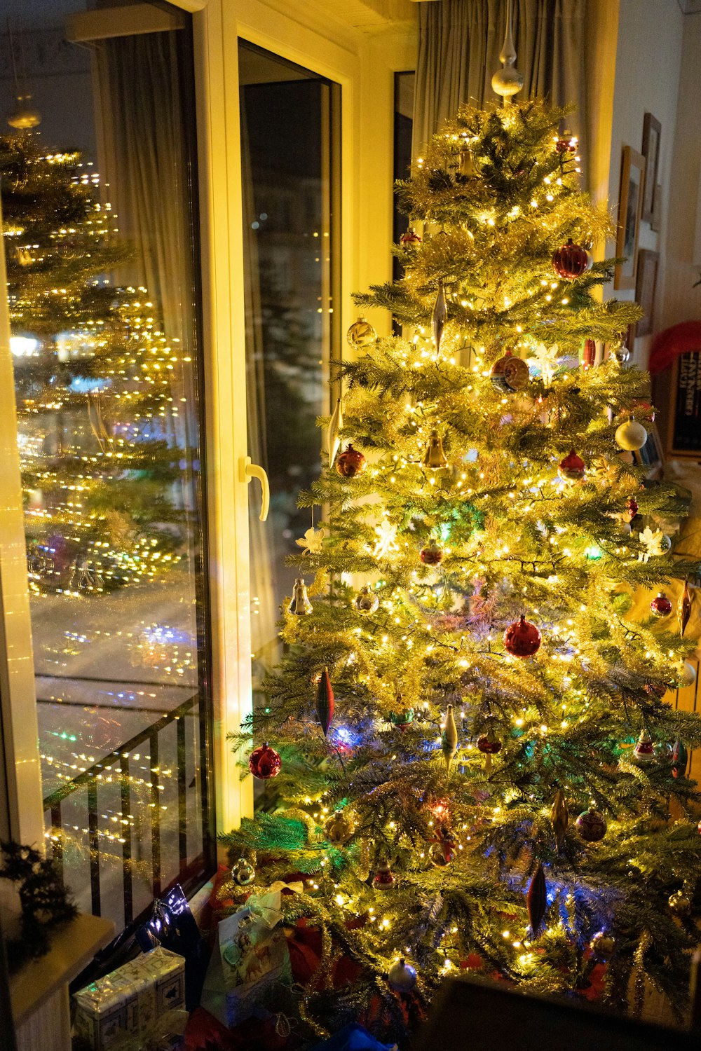 a lit christmas tree in a living room