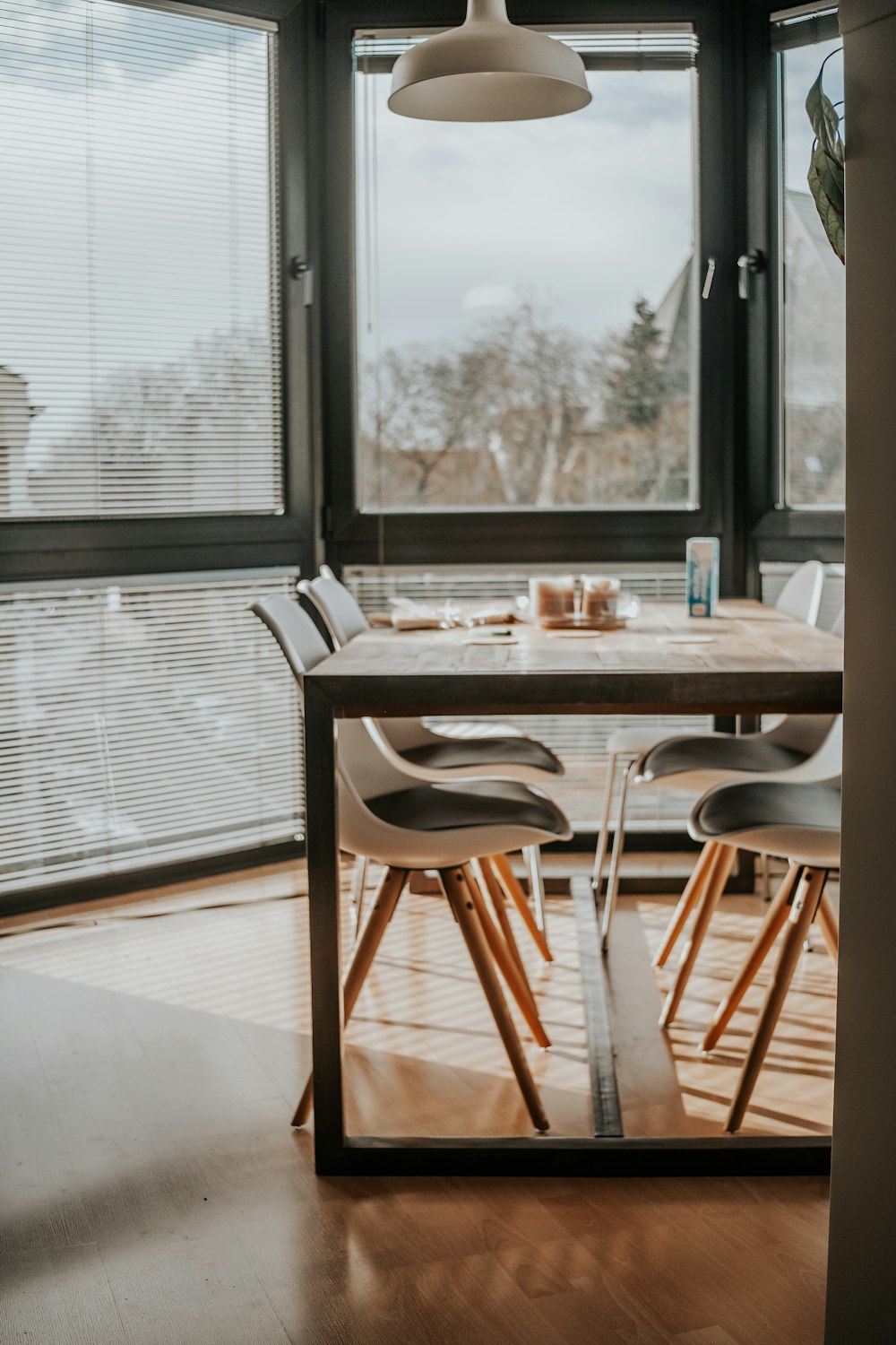 a dining room with a table and chairs