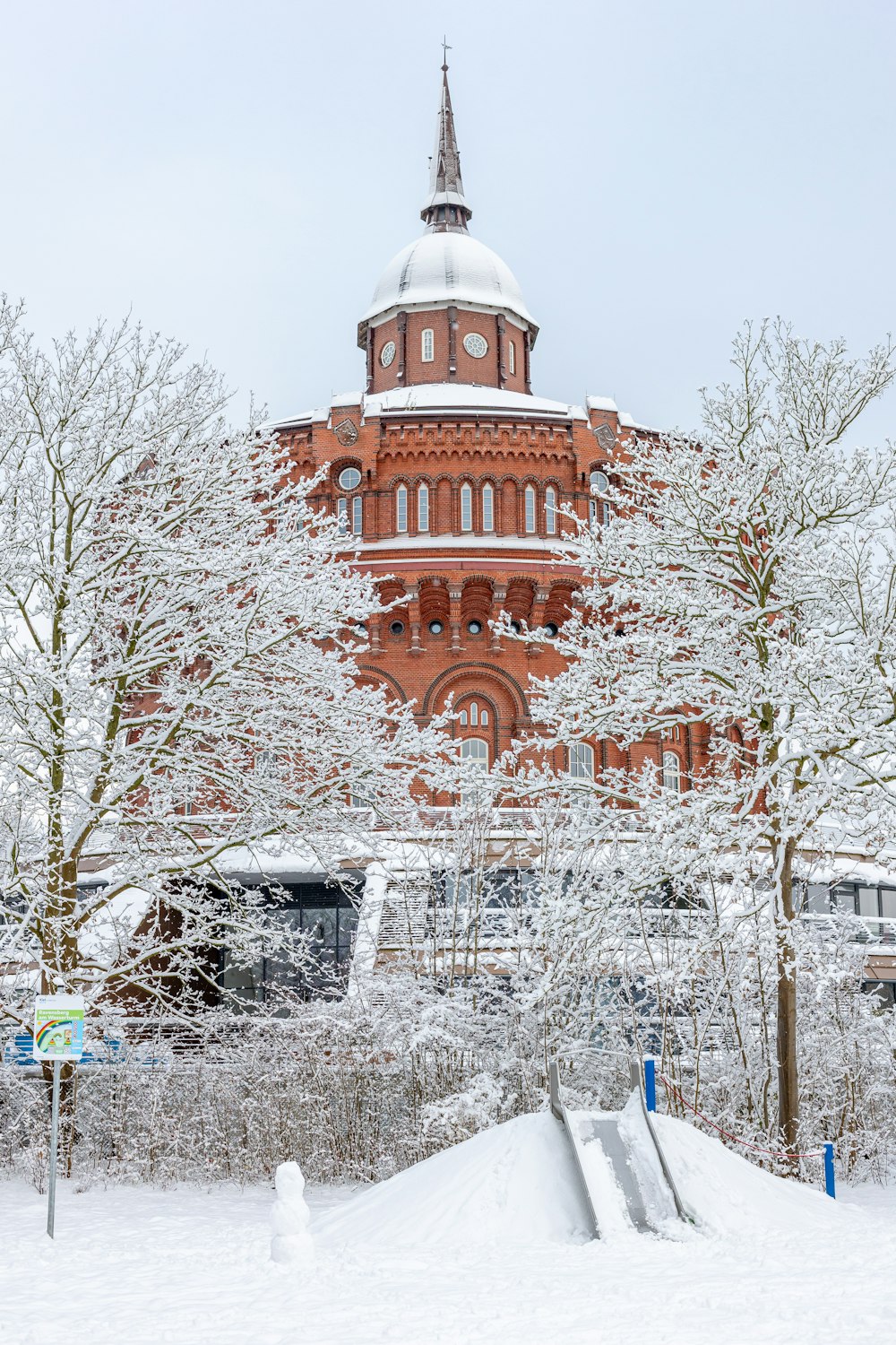 a red brick building with a white dome