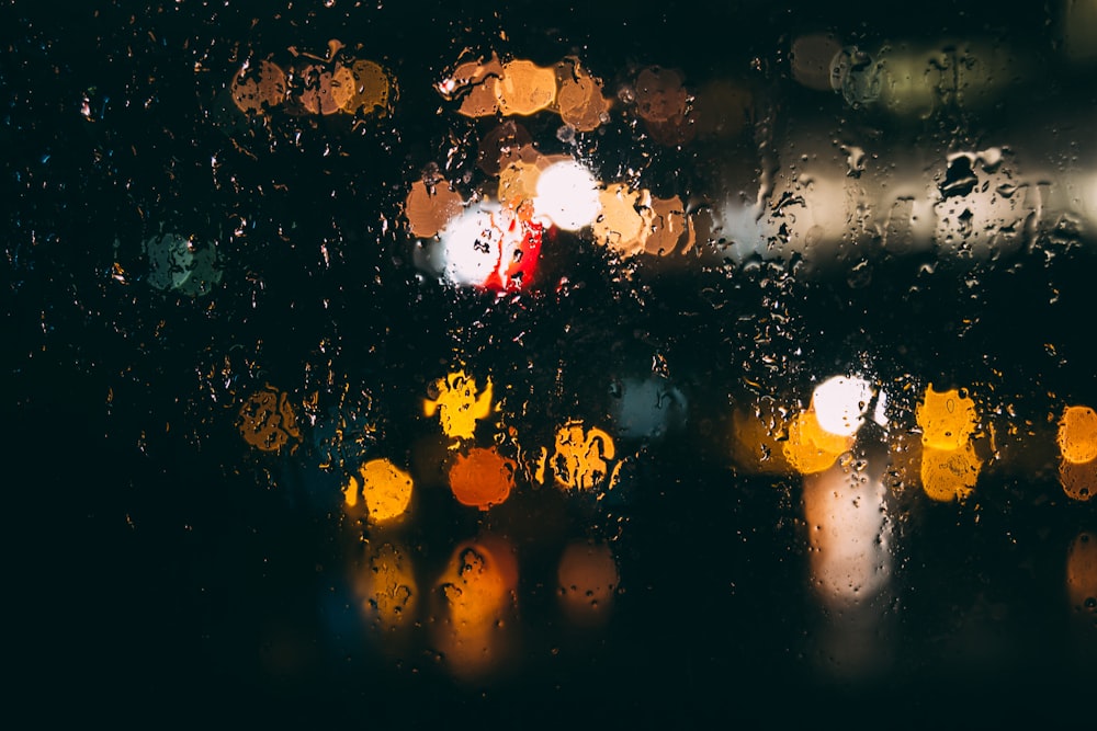 a close up of a rain covered window