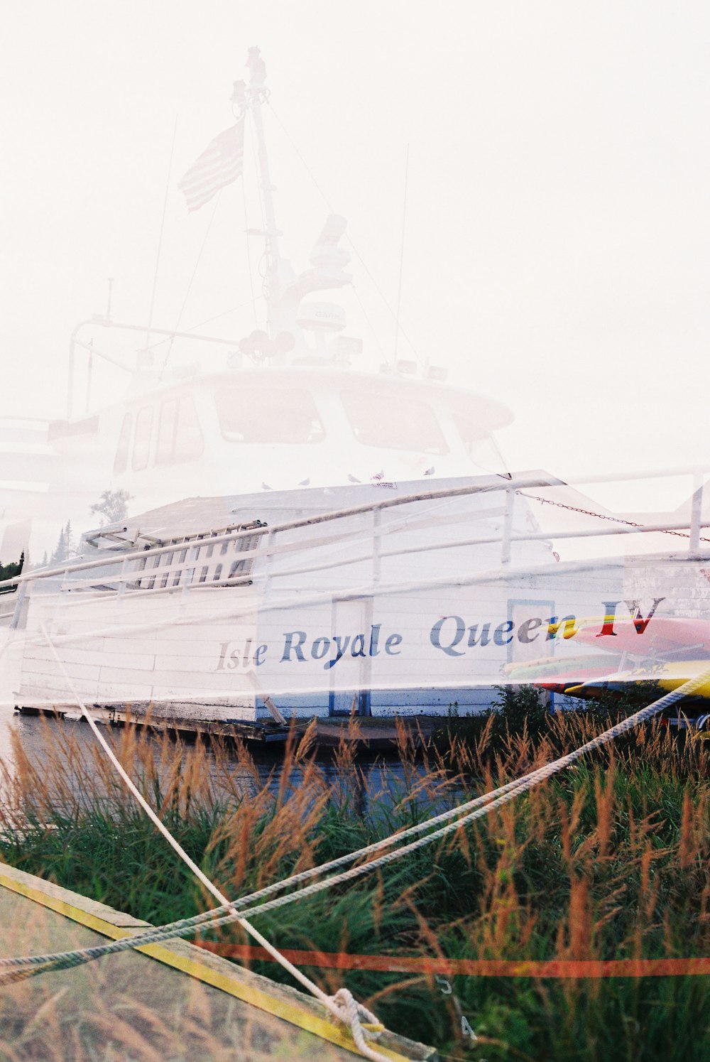 a large white boat sitting on top of a body of water