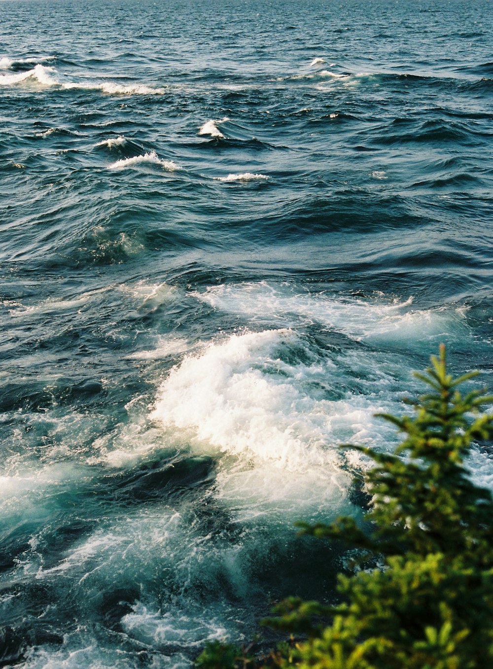 a body of water with a boat in the distance