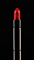 A vibrant lipstick application with bold red color on a model's lips.