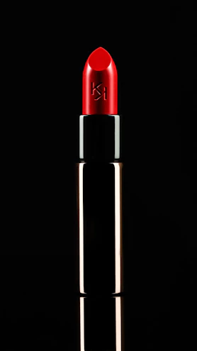 Elegant premium lipstick shades displayed on a vibrant pink backdrop