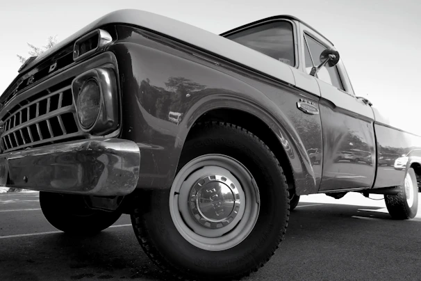 Side view of a freshly detailed pickup truck with shiny wheels and perfectly cleaned windows