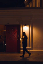 A compassionate mobile notary meeting a client at their doorstep in South Jersey during evening hours.