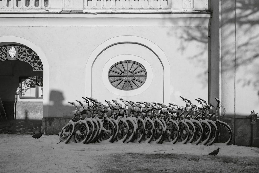 a group of bicycles parked in front of a building