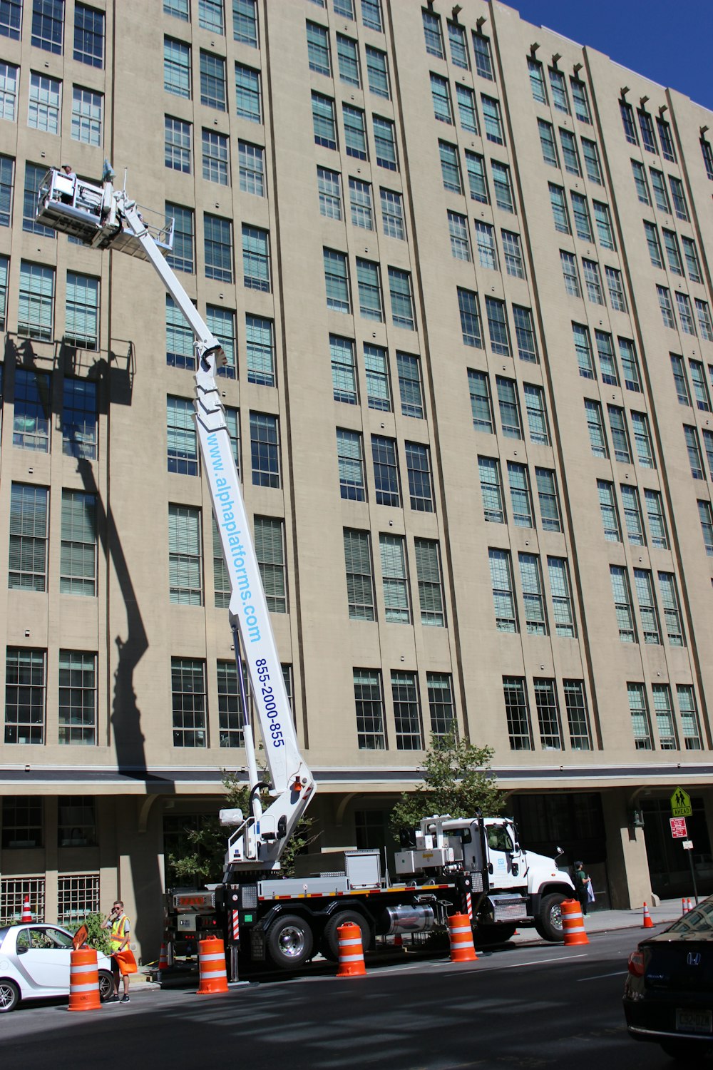 a large building being worked on by a crane