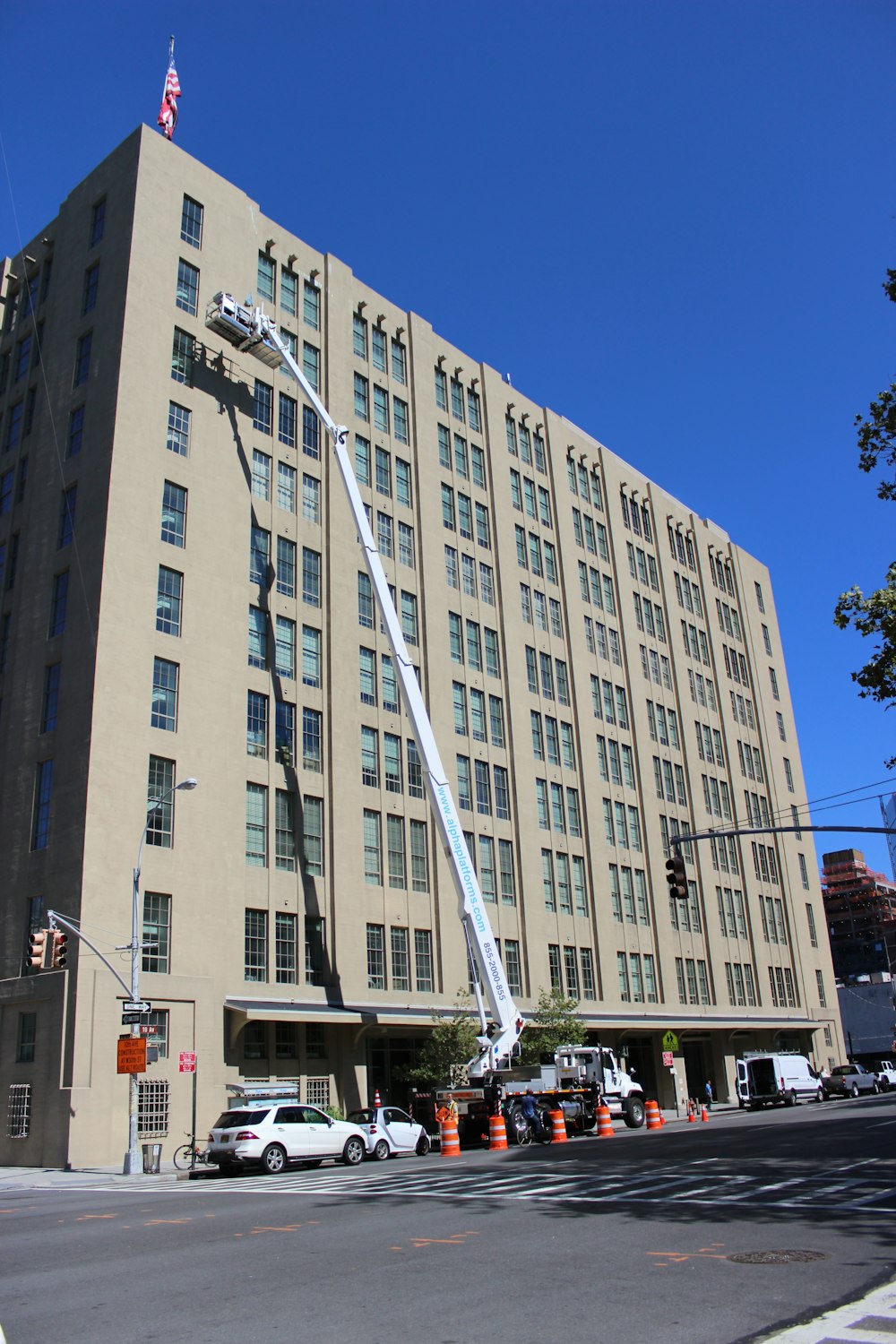 a large building with a crane in front of it