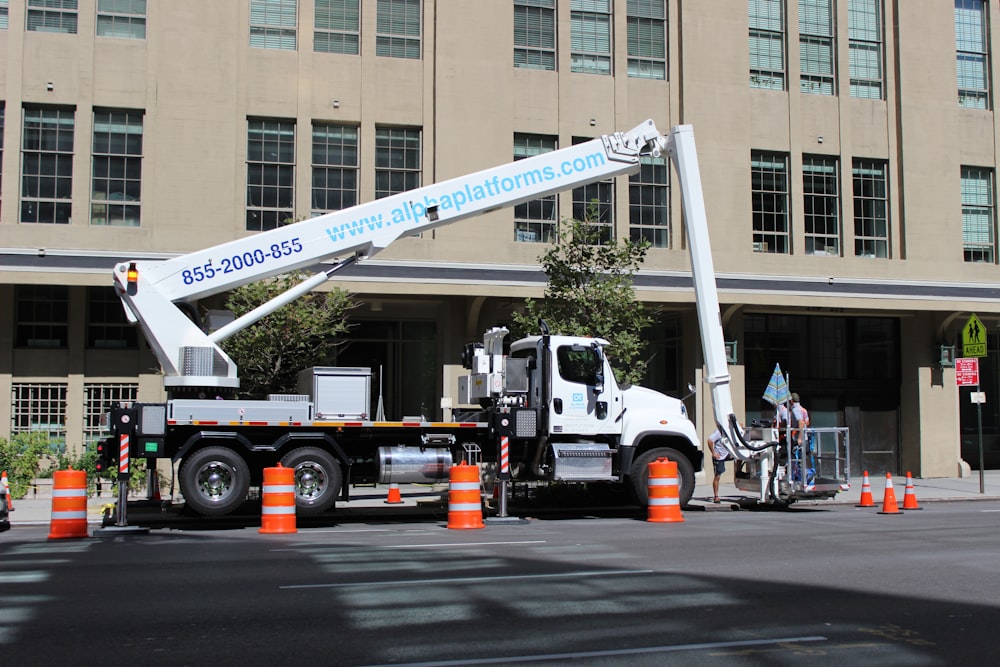 a large truck is parked in front of a building