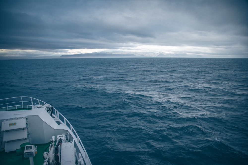 a large body of water under a cloudy sky