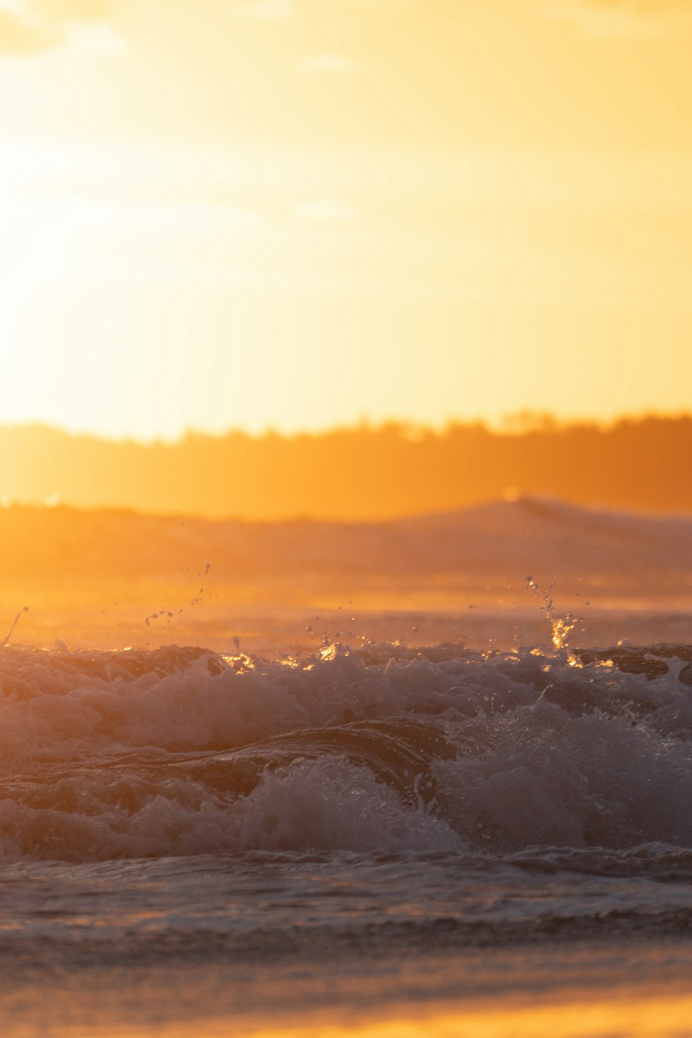 a man riding a surfboard on top of a wave in the ocean