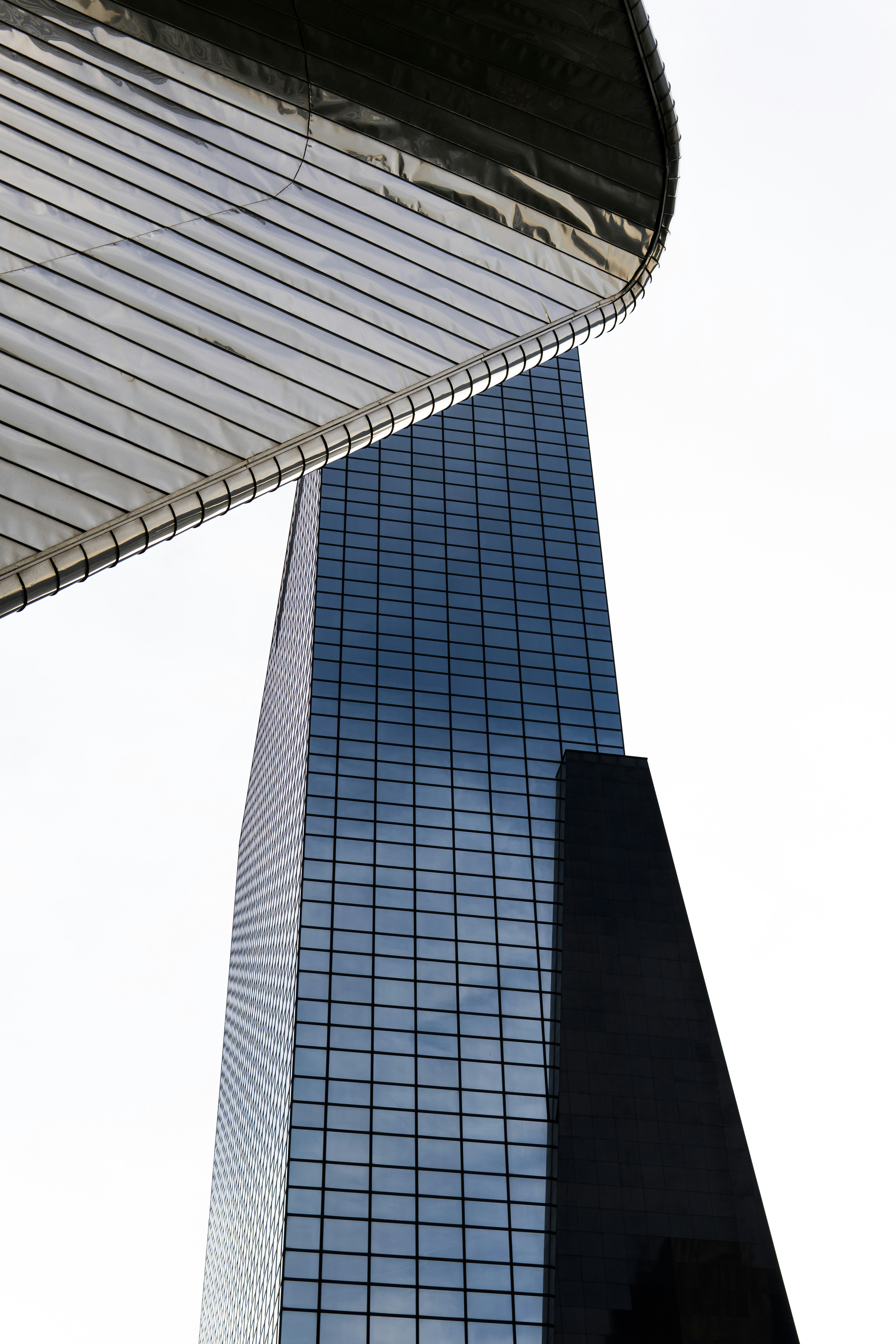 a very tall building next to a very tall building