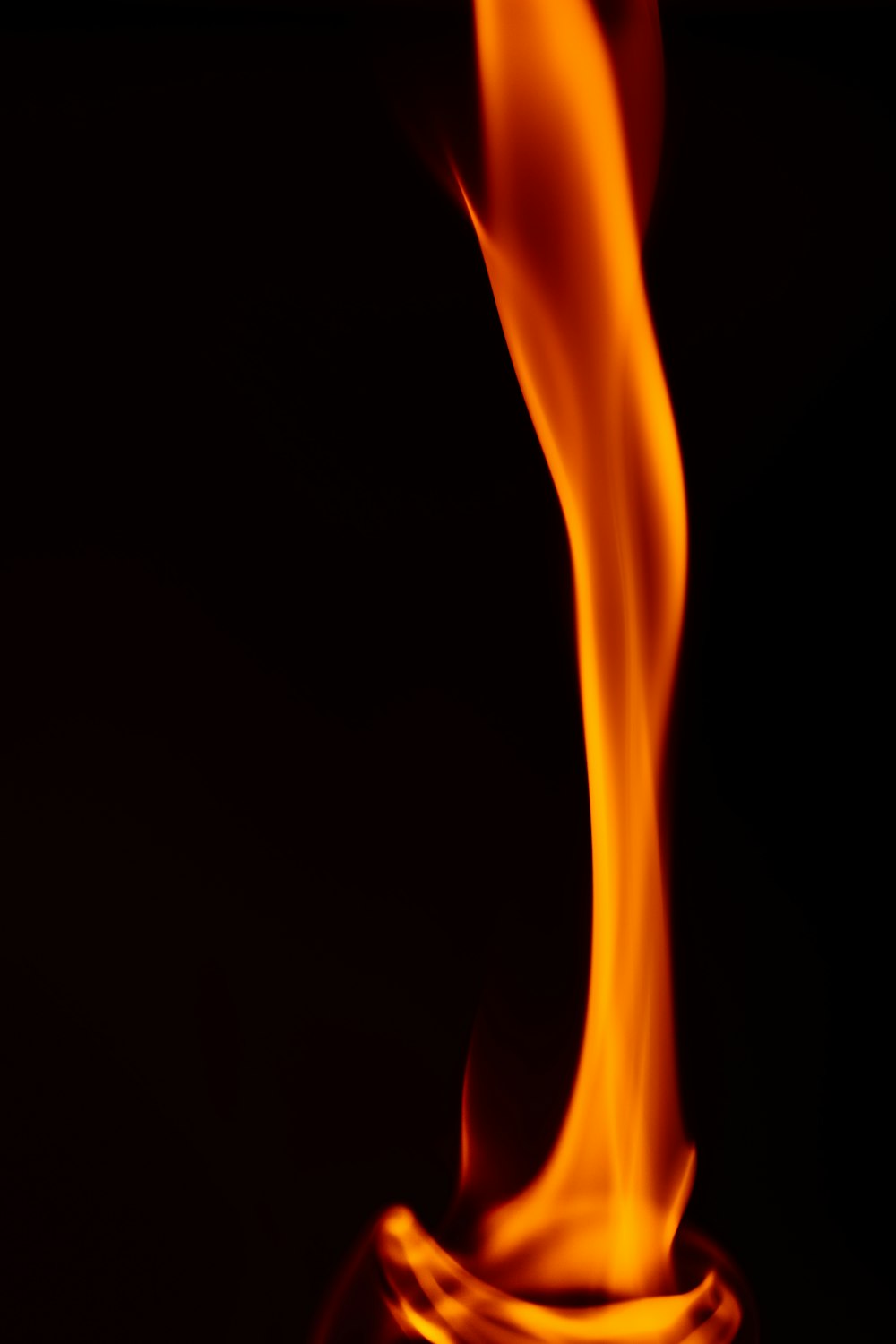 a close up of a fire with a black background