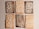 A set of six rectangular cookies arranged in two rows of three on a light background. The cookies have intricate floral patterns made of powdered sugar on their surfaces. There are two types, one with a darker brown color and another with a lighter golden-brown hue.