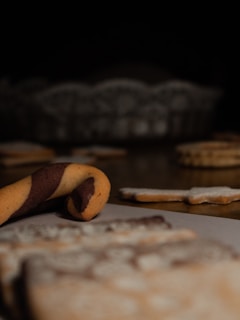 A close-up of gourmet cookies arranged on a wooden platter.