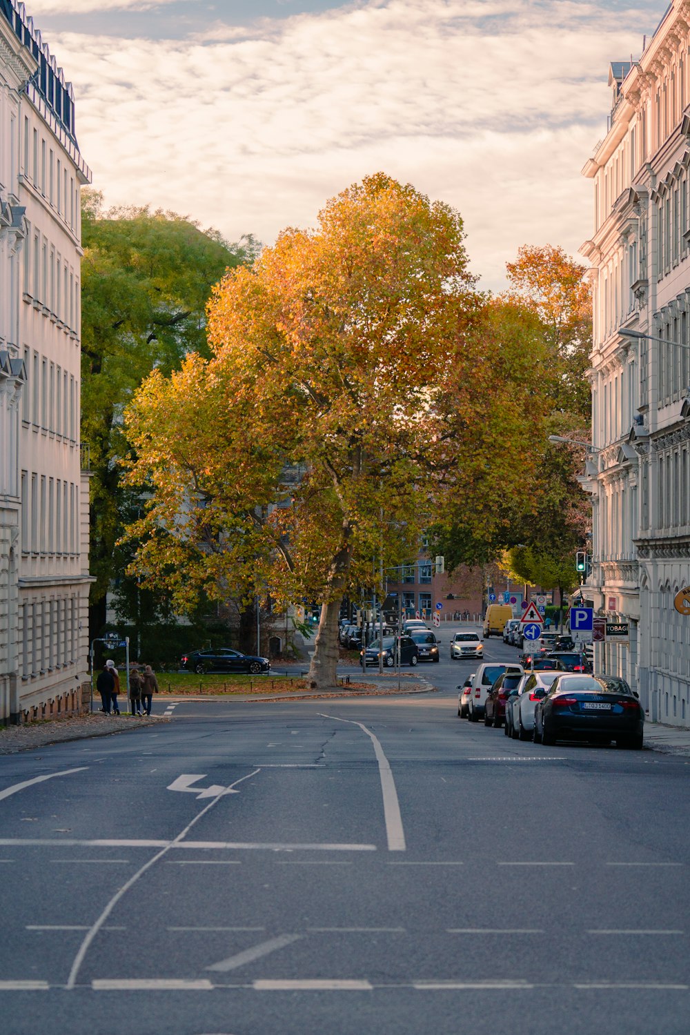 a street with cars parked on the side of it