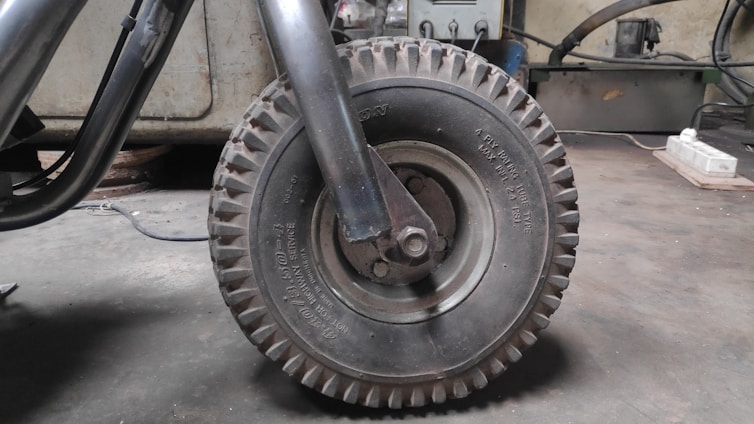 Close-up of a skilled worker shaping rubber compounds in a vibrant Mexican factory setting.