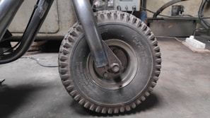 Close-up of wheel balancing machine in use with a tire mounted
