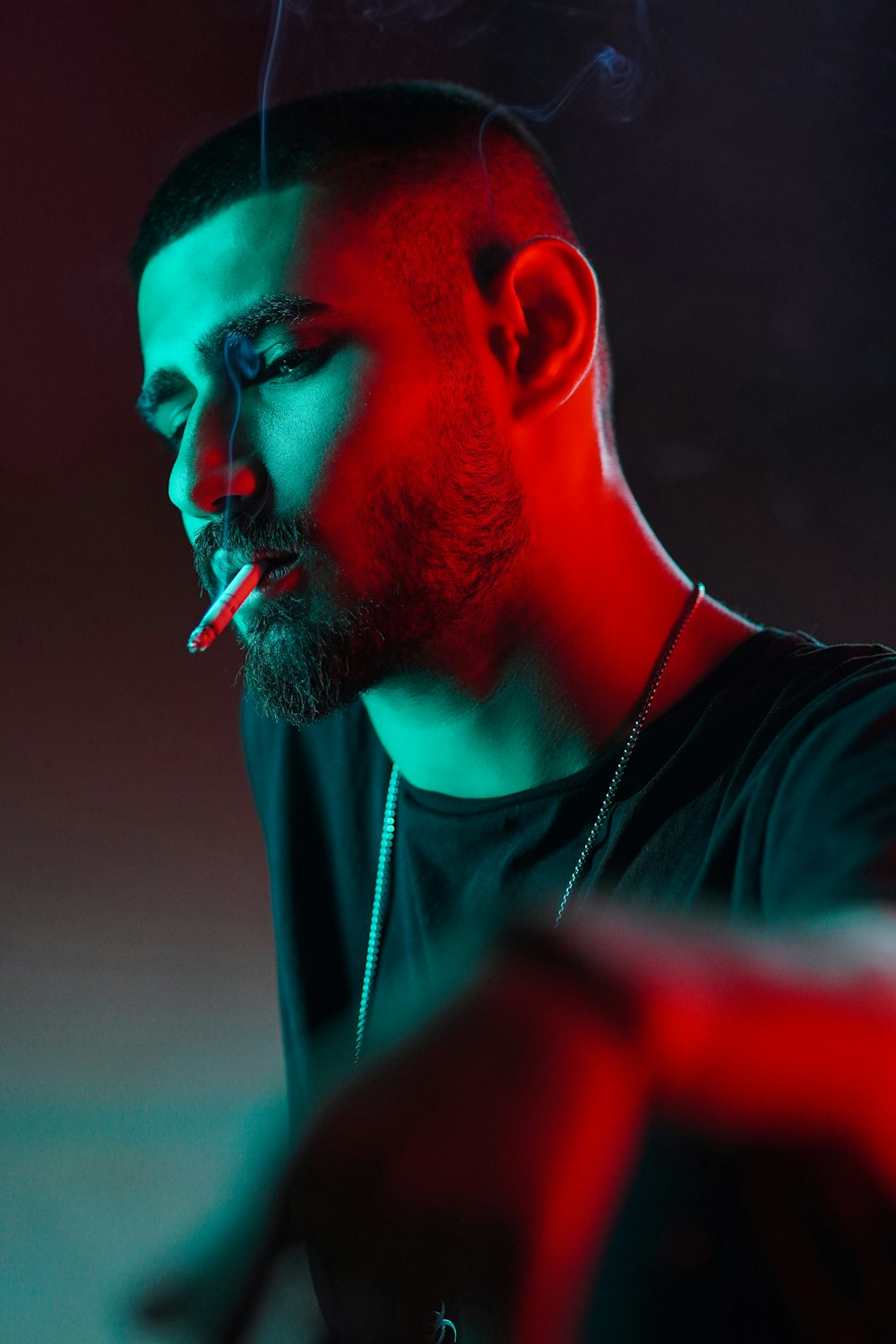 a man with a cigarette in his mouth