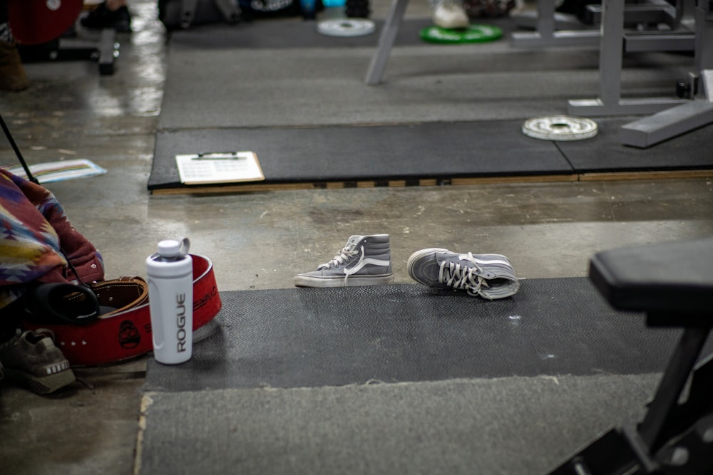 a pair of shoes sitting on a gym floor