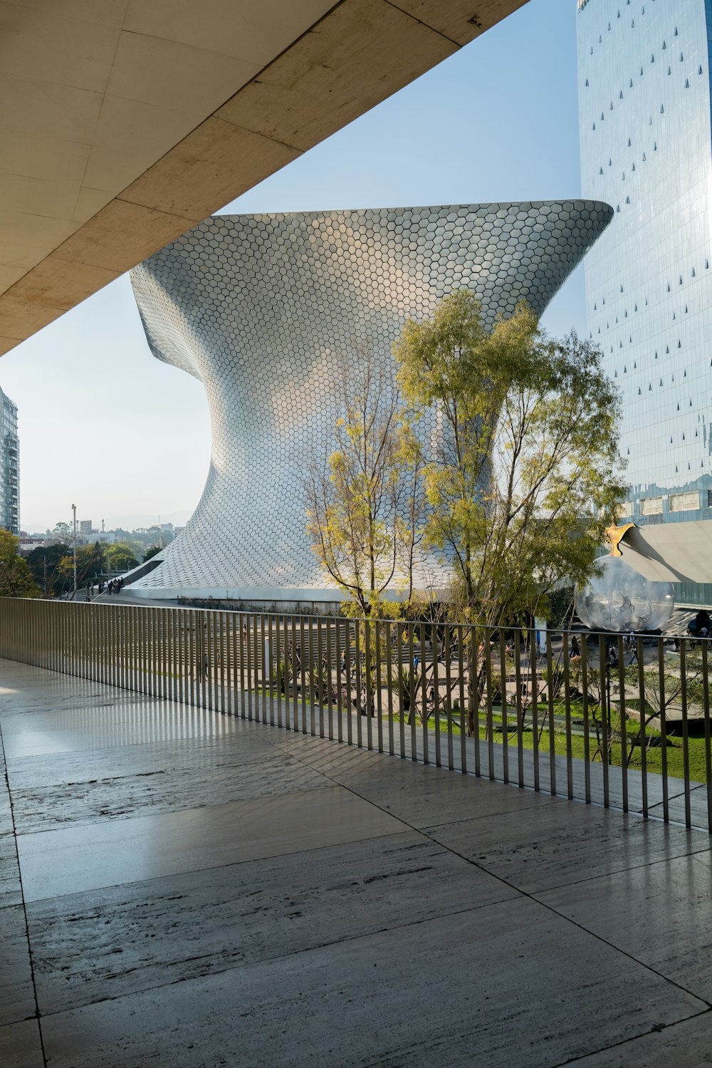 a large building with a metal fence around it