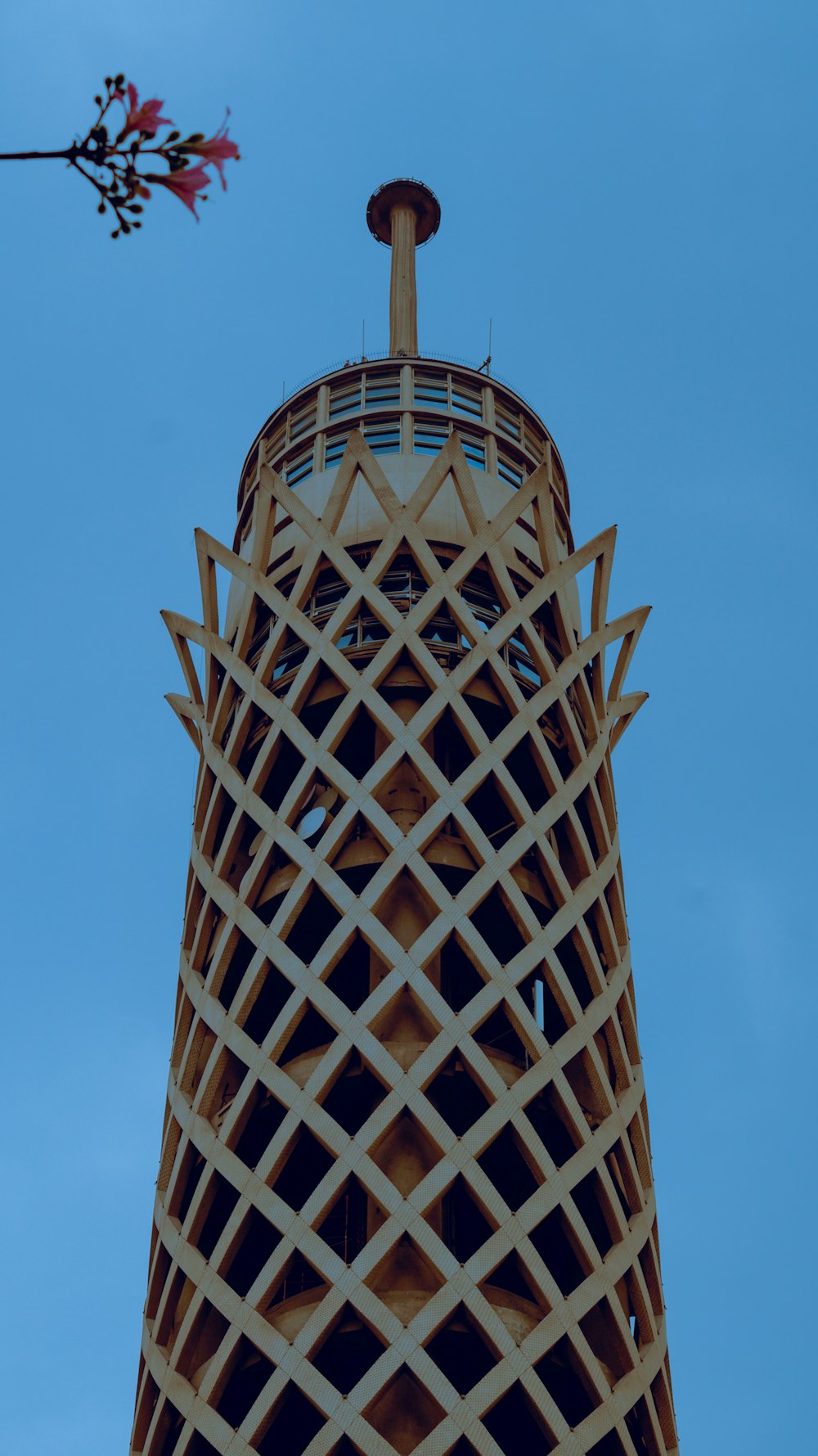 a very tall tower with a clock on it's side