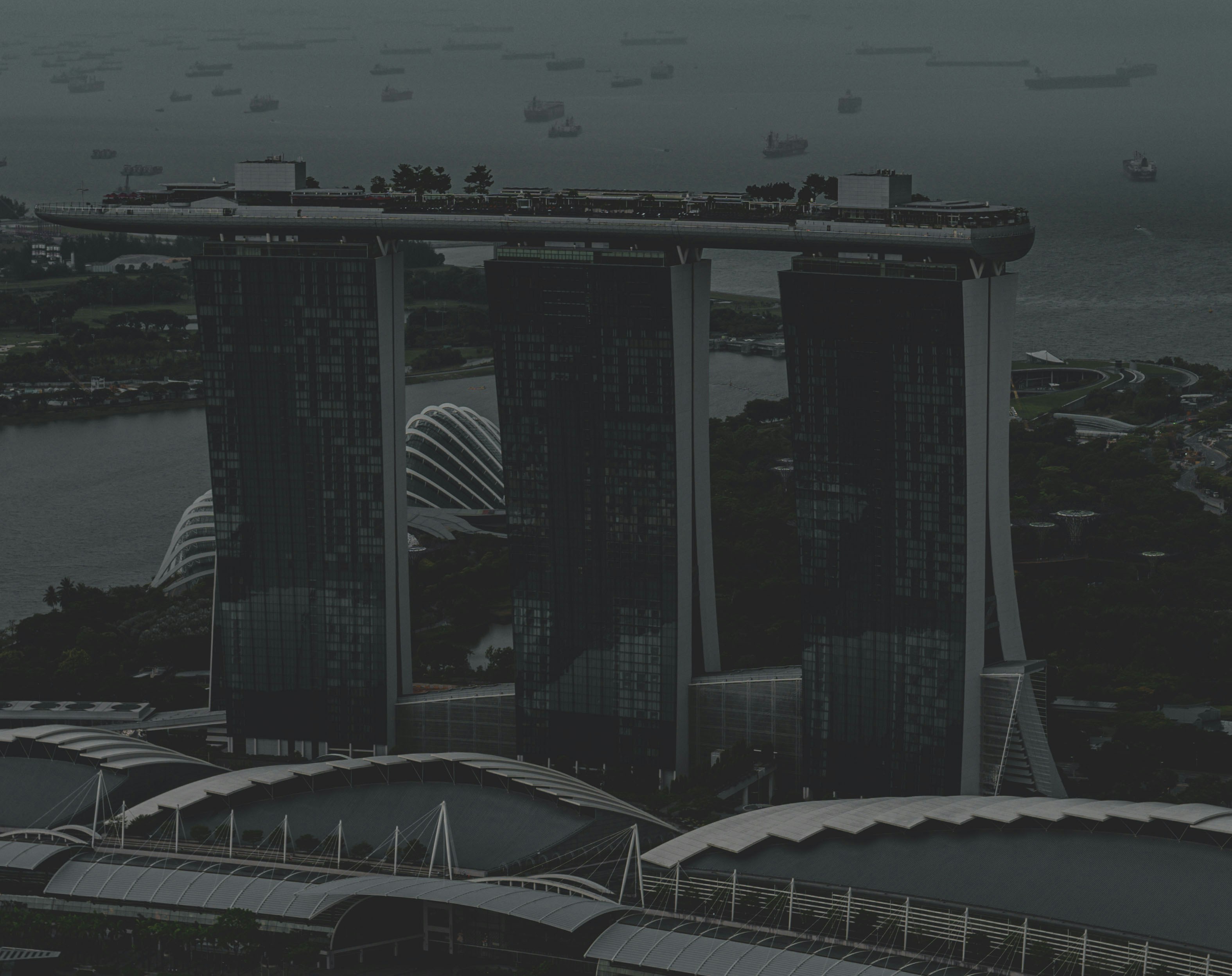 an aerial view of a city with tall buildings