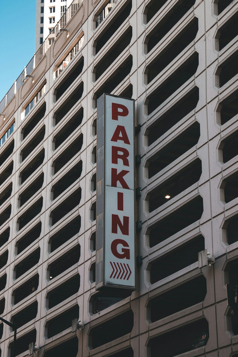 a parking sign on the side of a building