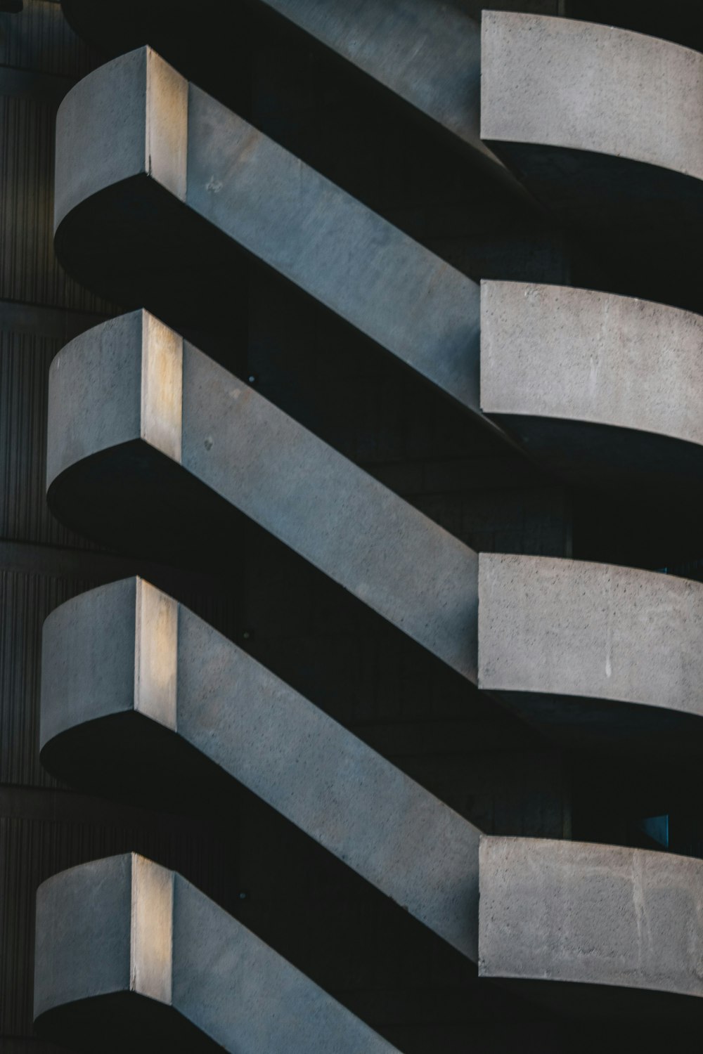 a close up of a building with concrete balconies