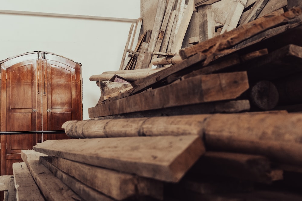 a large pile of wood in a warehouse